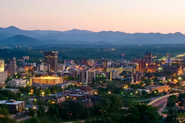 Downtown at dusk, ringed by the Blue Ridge