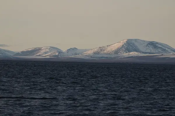 A lagoon beneath the hills