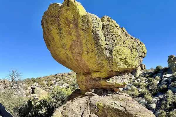 A balanced boulder on the trail