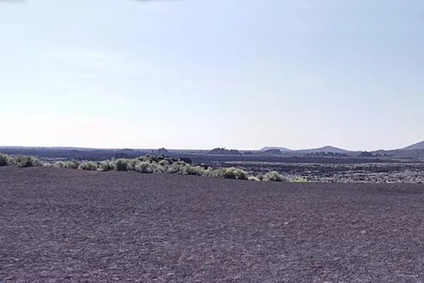 Lava flows below distant peaks