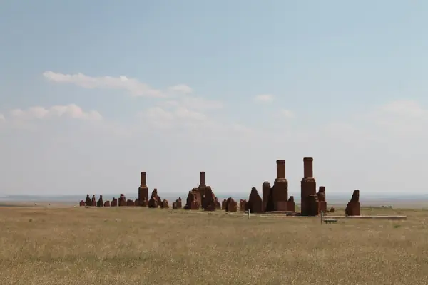 Adobe chimneys stand on the open plain