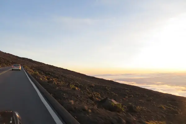 The road climbs above the clouds