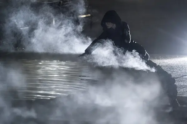 Steam rising from a spring on a cold morning