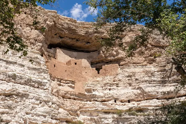 The dwelling set into the limestone cliff