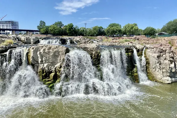 The Big Sioux River cascades over pink quartzite